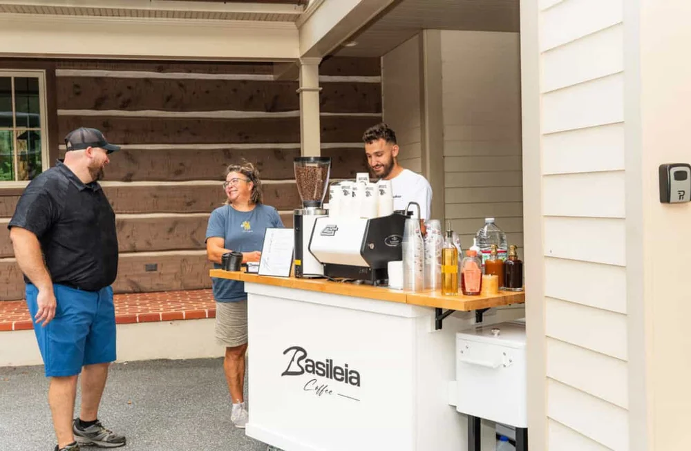 Coffee cart catering with trained baristas serving handcrafted espresso and high quality drinks.