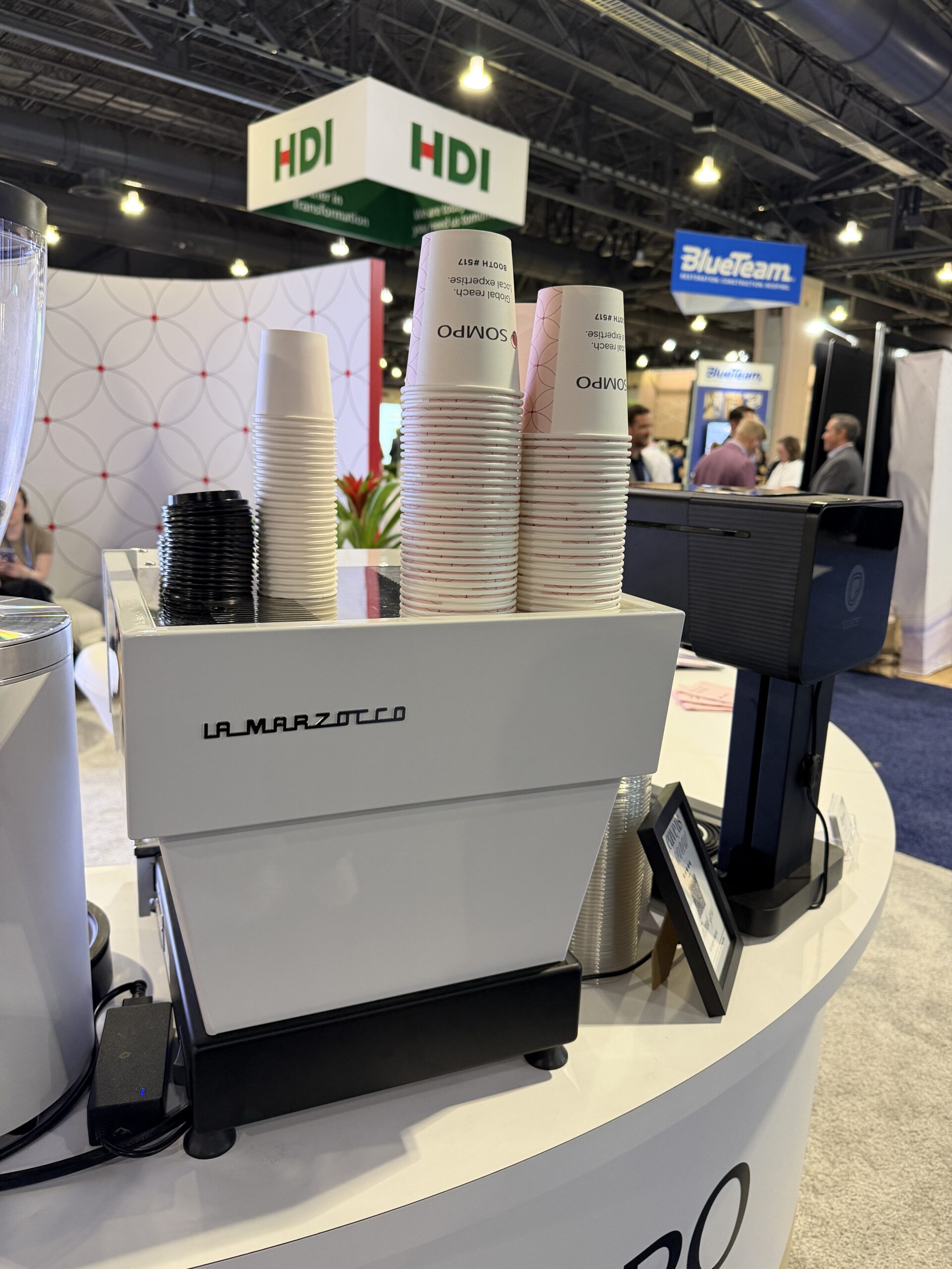 Basileia barista pulling espresso at insurance industry conference Philadelphia