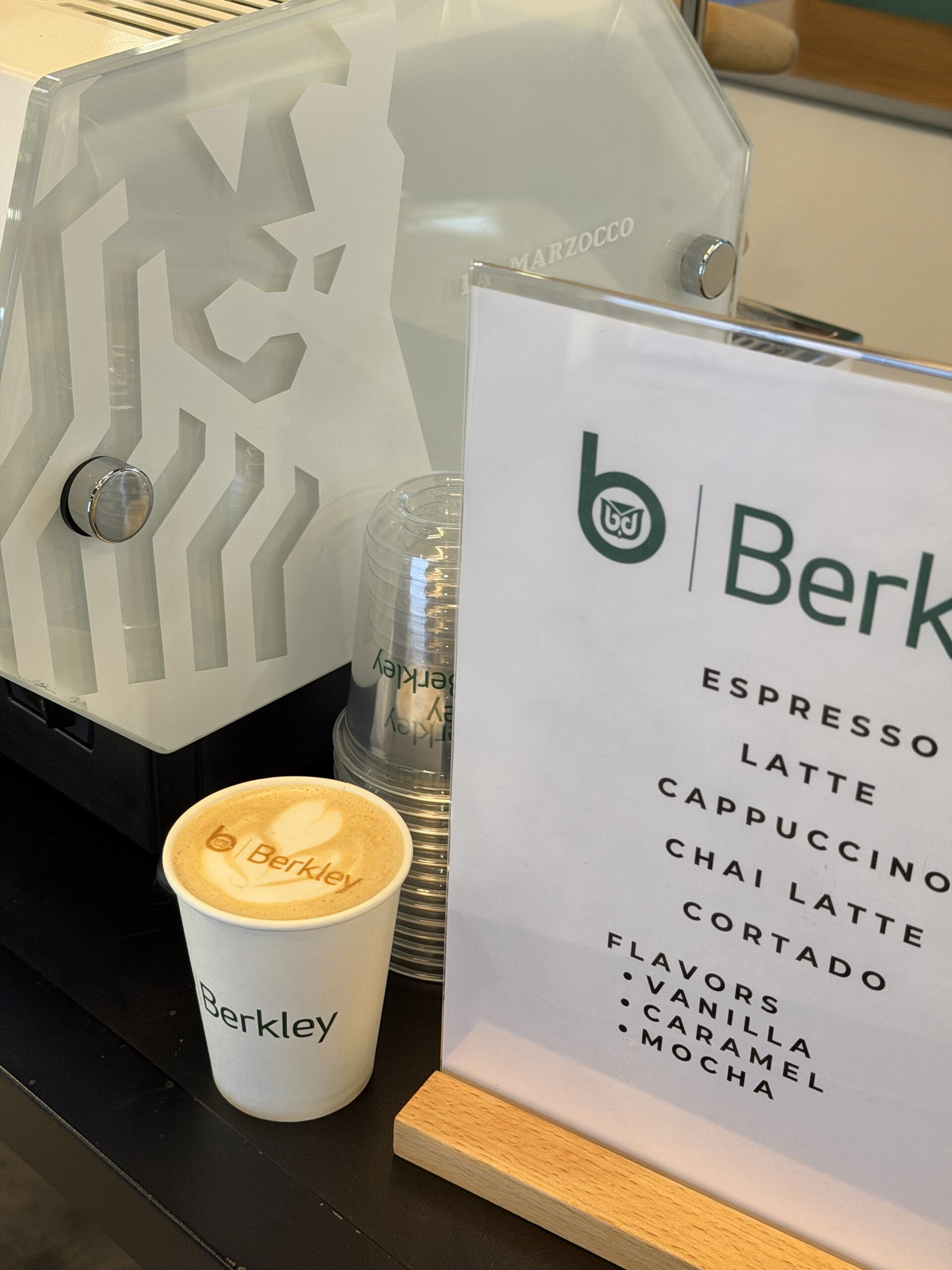 Custom branded coffee menu card at RIMS RiskWorld Philadelphia conference booth